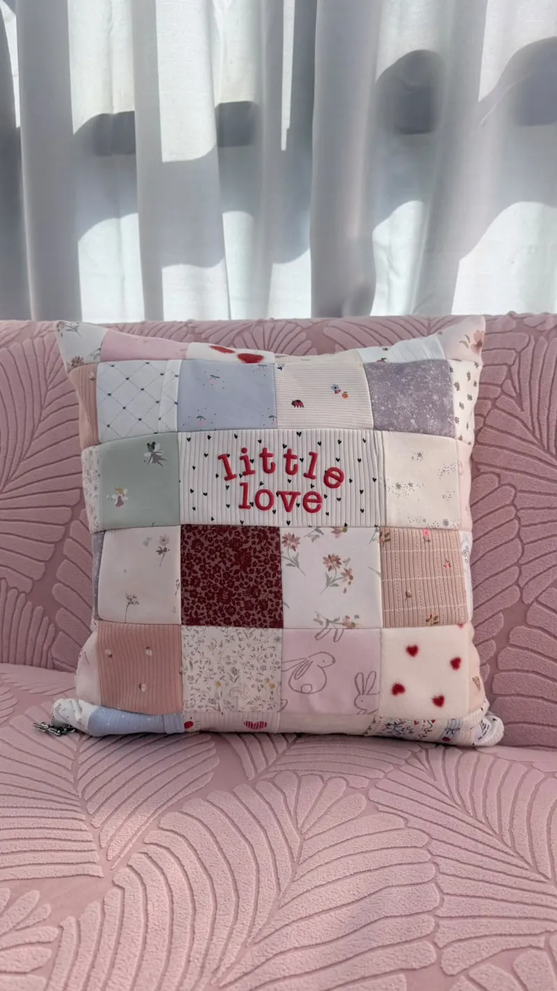 'little love' patchwork cushion made from baby clothes